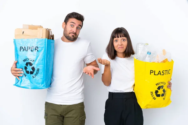 Young Couple Holding Bag Full Plastic Paper Recycle Isolated White — Zdjęcie stockowe