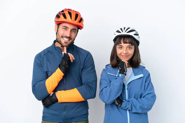 Young Cyclist Couple Isolated White Background Smiling Looking Front Confident — Stock Fotó