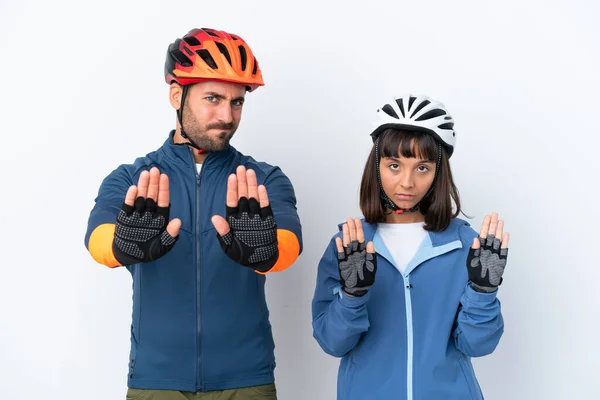 Young Cyclist Couple Isolated White Background Making Stop Gesture Disappointed — Stock Fotó