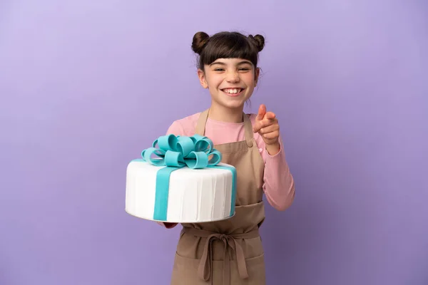 Pastry Little Girl Holding Big Cake Isolated Purple Background Surprised — Fotografia de Stock
