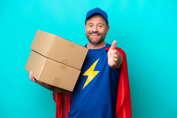 Super Hero Delivery Man Isolated Blue Background Shaking Hands Closing — 스톡 사진