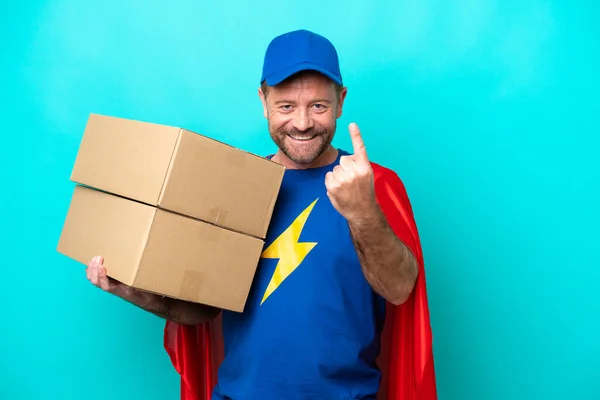 Super Hero Delivery Man Isolated Blue Background Doing Coming Gesture — Zdjęcie stockowe