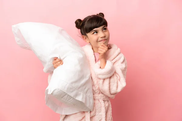 Little Caucasian Girl Isolated Pink Background Pajamas Holding Pillow While — Stock fotografie
