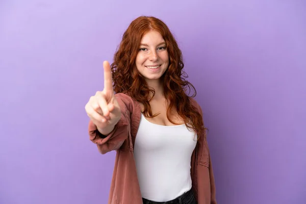 Teenager Redhead Girl Isolated Purple Background Showing Lifting Finger — Foto de Stock