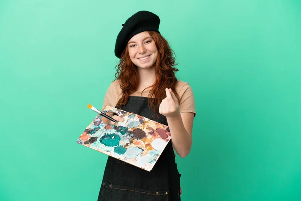 Teenager Redhead Artist Holding Palette Isolated Green Background Making Money — Stock Photo, Image
