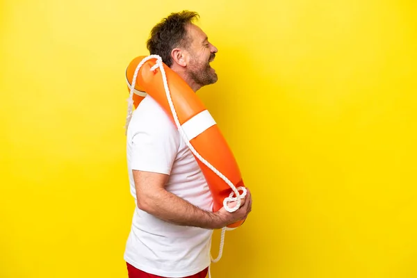 Lifeguard Middle Age Man Isolated Yellow Background Laughing Lateral Position — 스톡 사진