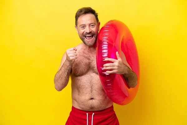 Middle Age Caucasian Man Holding Inflatable Donut Isolated Yellow Background — Fotografia de Stock