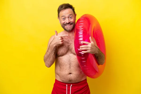 Middle Age Caucasian Man Holding Inflatable Donut Isolated Yellow Background — Fotografia de Stock