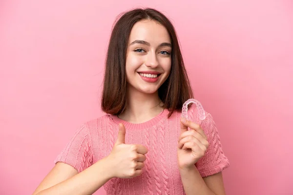 Young Ukrainian Woman Holding Invisible Braces Isolated Pink Background Thumbs — 스톡 사진
