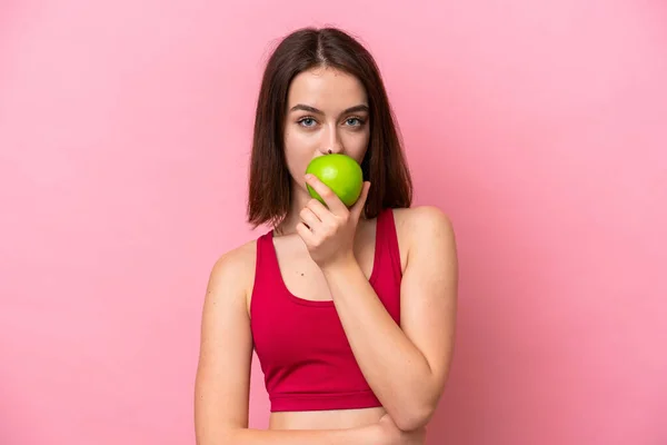 Young Ukrainian Woman Isolated Pink Background Eating Apple — Stockfoto