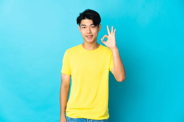 Young Chinese Man Isolated Blue Background Showing Sign Fingers — Stock Photo, Image