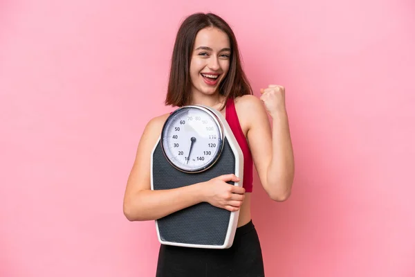 Young Ukrainian Woman Isolated Pink Background Weighing Machine Doing Victory — Stock Fotó