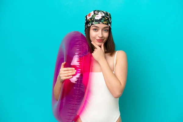 Young Ukrainian Woman Holding Air Mattress Isolated Blue Background Thinking — Stockfoto