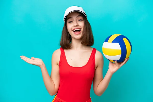 Young Ukrainian Woman Playing Volleyball Beach Isolated Blue Background Shocked — Photo