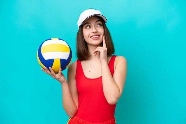 Young Ukrainian Woman Playing Volleyball Beach Isolated Blue Background Thinking — Stok fotoğraf