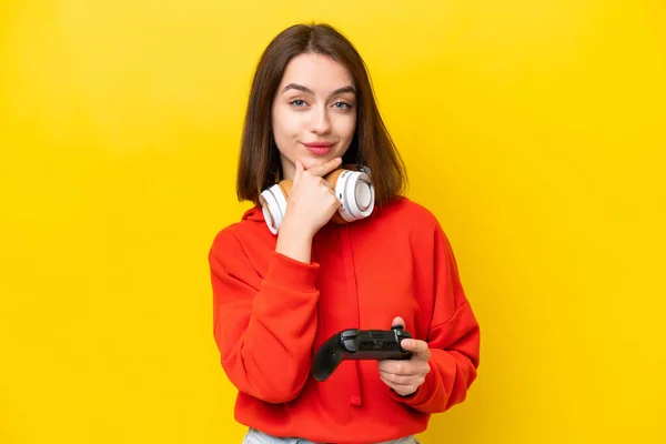 Young Ukrainian Woman Playing Video Game Controller Isolated Yellow Background —  Fotos de Stock
