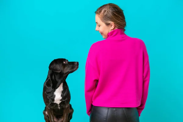 Young Caucasian Woman Her Dog Isolated Blue Background Back Position — 스톡 사진