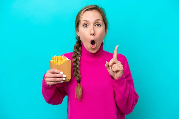 Young Caucasian Woman Holding Fried Chips Isolated Blue Background Intending — Foto Stock