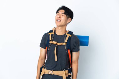 Mountaineer Chinese man with isolated on white background laughing