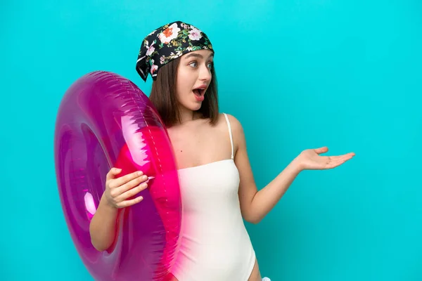 Young Ukrainian Woman Holding Air Mattress Isolated Blue Background Surprise — Stock Photo, Image