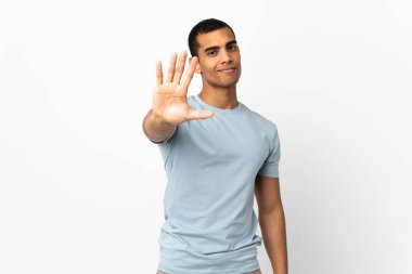 African American man over isolated white background counting five with fingers