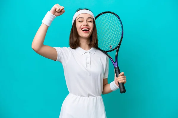 Young Ukrainian Woman Isolated Blue Background Playing Tennis Celebrating Victory — Stok fotoğraf