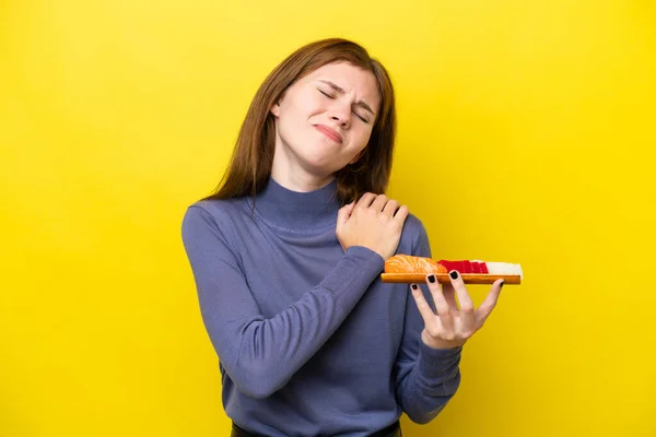 Young English Woman Holding Sashimi Isolated Yellow Background Suffering Pain — Stock Fotó