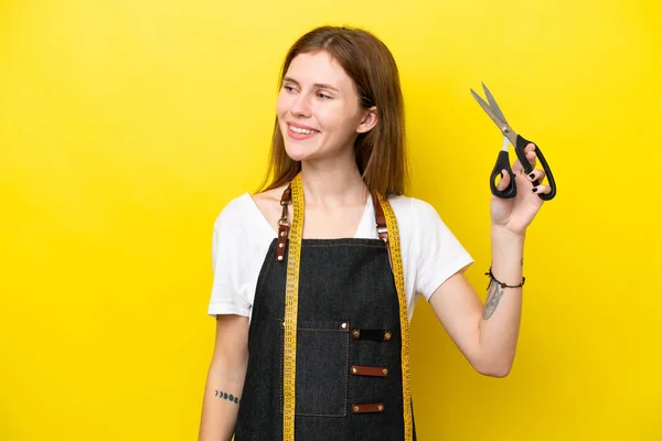 Young Seamstress English Woman Isolated Yellow Background Looking Side Smiling — Fotografia de Stock