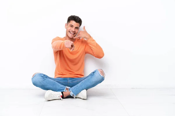 Young Man Sitting Floor Isolated White Background Making Phone Gesture — Stock Fotó