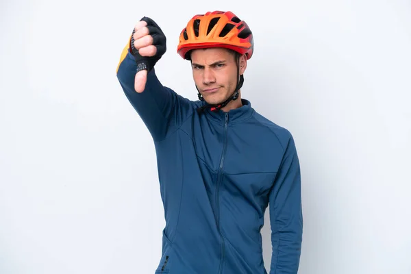 Young Cyclist Caucasian Man Isolated White Background Showing Thumb Negative — Foto de Stock