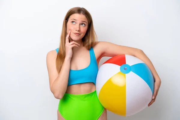 Young Woman Holding Beach Ball Holidays Isolated White Background Thinking — Stok fotoğraf