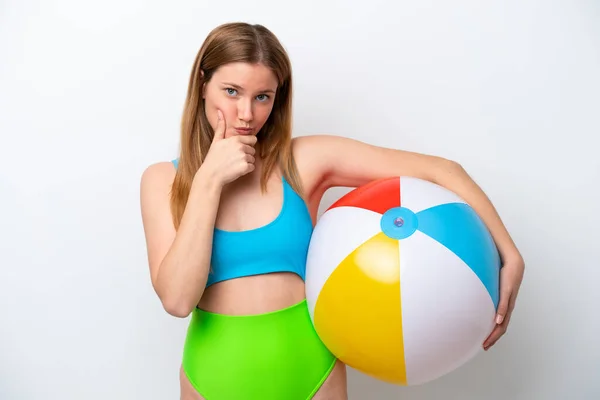 Young Woman Holding Beach Ball Holidays Isolated White Background Thinking — Stok fotoğraf