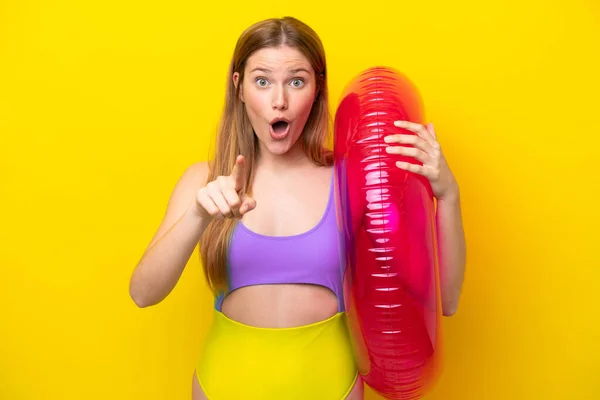 Young Caucasian Woman Holding Air Mattress Isolated Yellow Background Surprised — Stockfoto