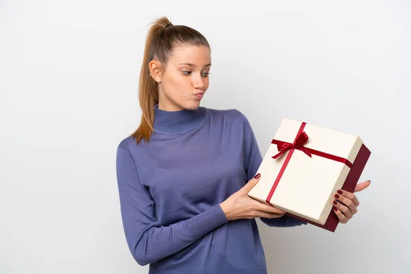 Young Caucasian Woman Holding Gift Isolated White Background Sad Expression — 스톡 사진