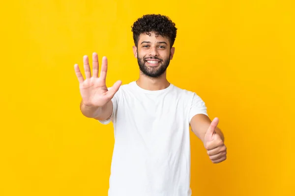 Young Moroccan Man Isolated Yellow Background Counting Six Fingers — Stock fotografie
