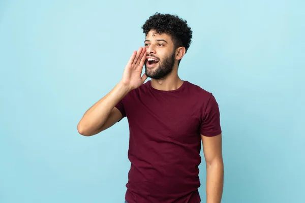 Young Moroccan Man Isolated Blue Background Shouting Mouth Wide Open — Stok fotoğraf