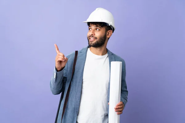 Young Architect Moroccan Man Helmet Holding Blueprints Isolated Background Pointing — Fotografia de Stock