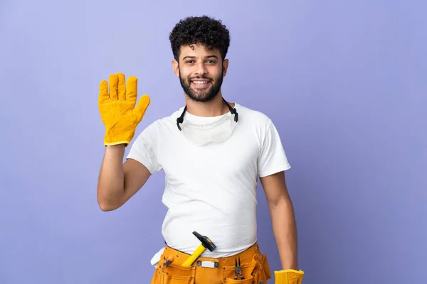 Young Electrician Moroccan Man Isolated Purple Background Saluting Hand Happy — Stock Fotó