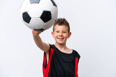 Boy playing football over isolated white wall