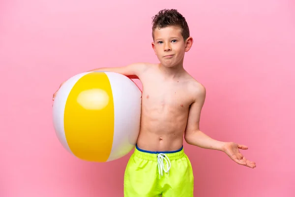 Little Caucasian Boy Holding Beach Ball Isolated Pink Background Making — Stockfoto
