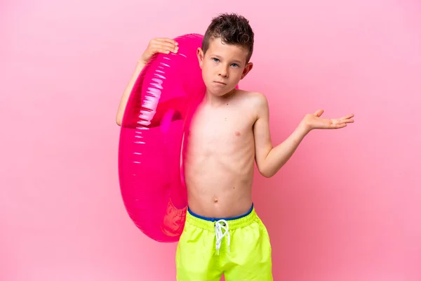 Little Caucasian Boy Holding Inflatable Donut Isolated Pink Background Having —  Fotos de Stock
