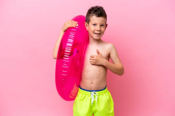 Little Caucasian Boy Holding Inflatable Donut Isolated Pink Background Giving — Zdjęcie stockowe