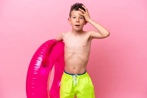 Little Caucasian Boy Holding Inflatable Donut Isolated Pink Background Surprise — Photo