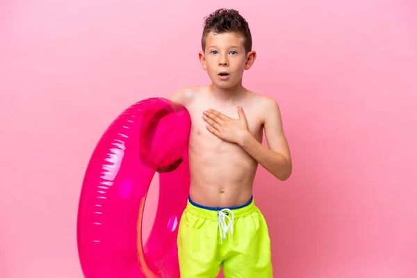 Little Caucasian Boy Holding Inflatable Donut Isolated Pink Background Surprised — Photo