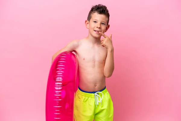 Little Caucasian Boy Holding Inflatable Donut Isolated Pink Background Giving —  Fotos de Stock