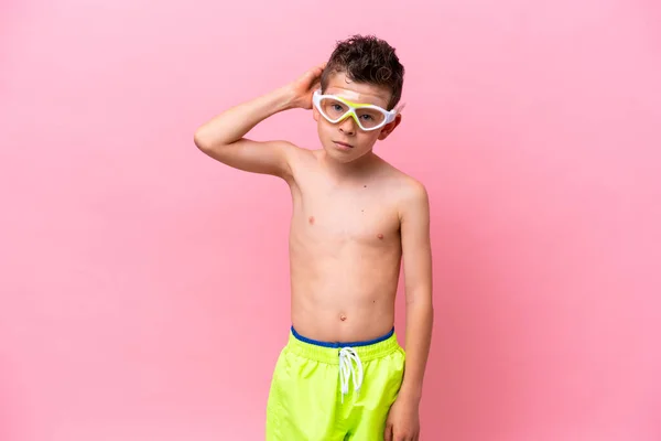 Little Caucasian Boy Wearing Diving Goggles Isolated Pink Background Having — Stock Photo, Image