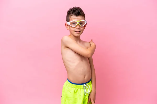Little Caucasian Boy Wearing Diving Goggles Isolated Pink Background Pointing — 스톡 사진