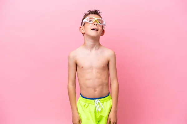 Little Caucasian Boy Wearing Diving Goggles Isolated Pink Background Laughing — 스톡 사진