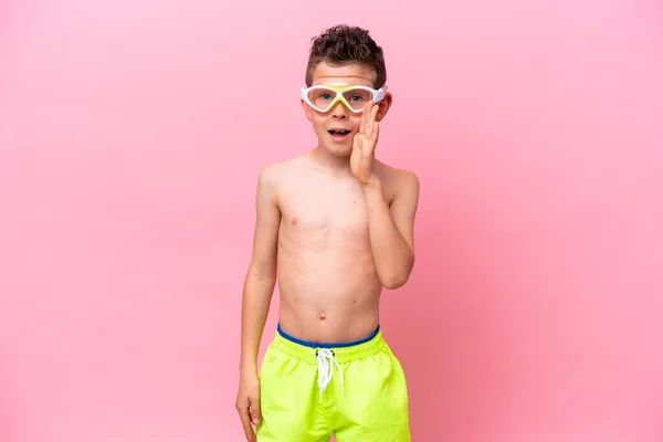 Little Caucasian Boy Wearing Diving Goggles Isolated Pink Background Shouting — стоковое фото