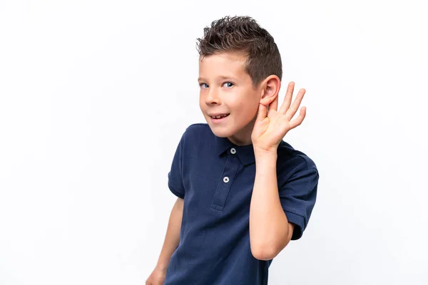 Little Caucasian Boy Isolated White Background Listening Something Putting Hand — стоковое фото